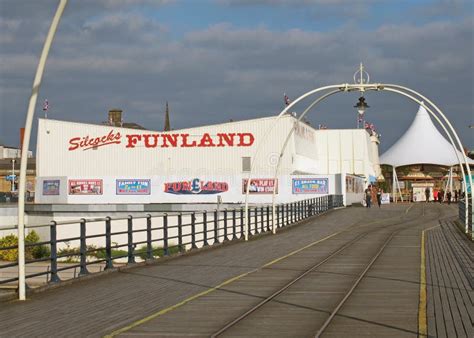 People Walking into the Entrance To Southport Pier in Merseyside with a ...