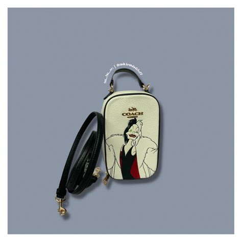 Jual Tas Sling Handphone Branded Wanita Coach Cc328 Disney Cruella Eva