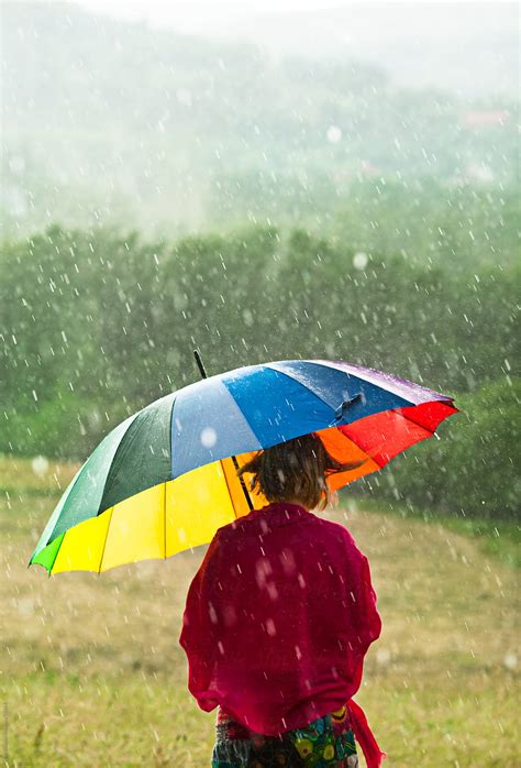 "Woman With Colorful Umbrella Enjoying Rain In The Meadow." by Stocksy ...