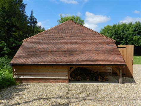 Cat Slide Log Store At The End Of A Two Bay Oak Garage Campagne