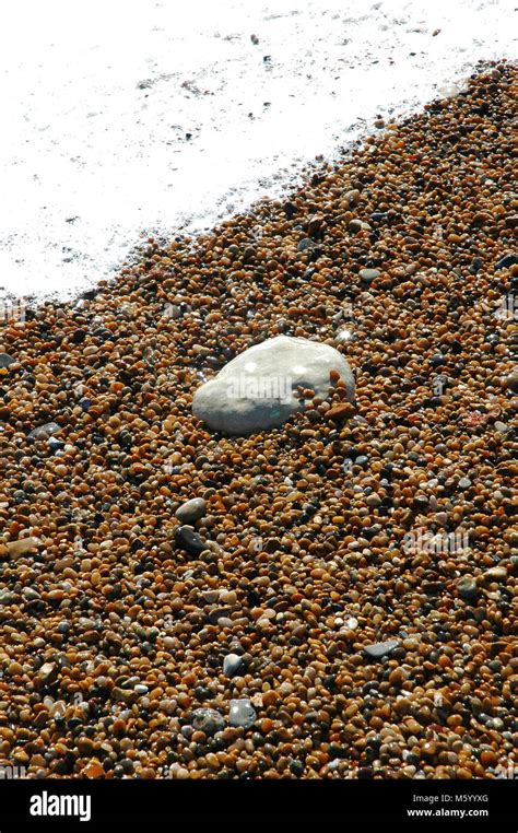 Pebbles Scattered On Beach Hi Res Stock Photography And Images Alamy