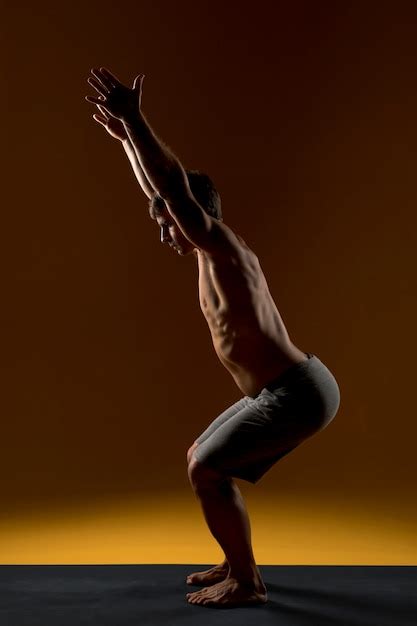 Free Photo Man Stretching On Yoga Mat