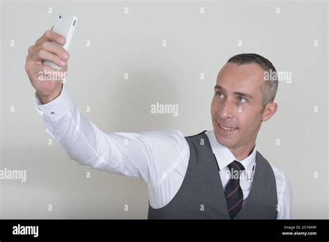 Portrait Of Happy Mature Handsome Businessman Against White Background Stock Photo Alamy
