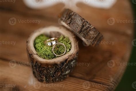 gold wedding rings with a wedding decor 14983333 Stock Photo at Vecteezy