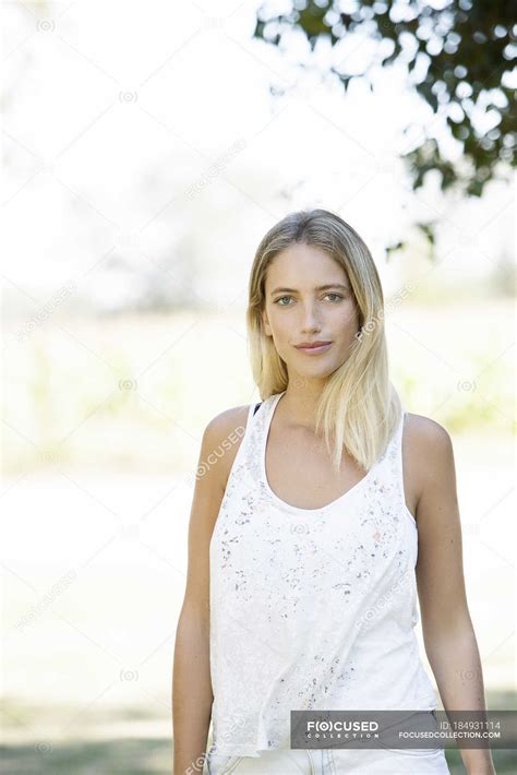 Portrait Of Blonde Woman Looking At The Camera Outdoors Summer Hair Stock Photo 184931114
