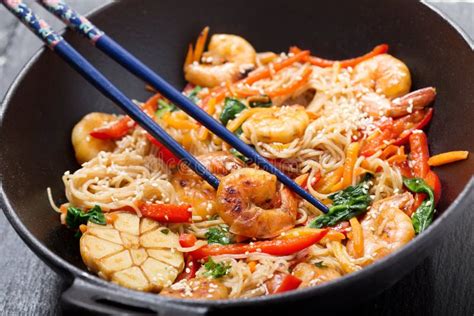 Stir Fried Noodles With Shrimps And Vegetables In A Wok Stock Photo