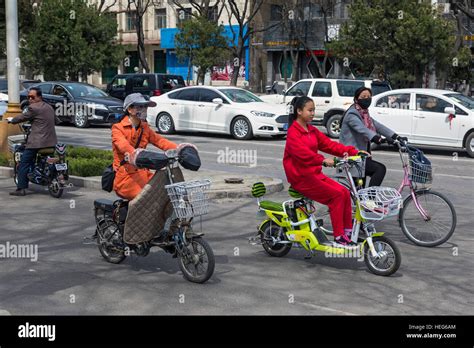 Cycling on bikes and ebikes in Shizuishan, Ningxia, China Stock Photo ...