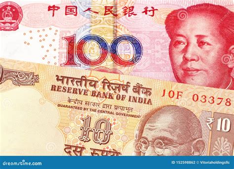 Ten Indian Rupees With One Hundred Chinese Yuan Stock Photo Image Of