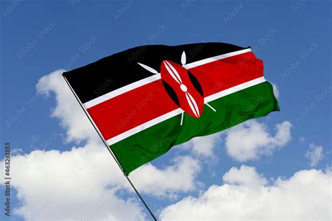 Kenya flag isolated on the blue sky background. close up waving flag of ...