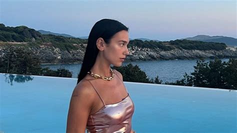 Dua Lipa Continues Her Mermaid Barbie Summer In A Pink Metallic