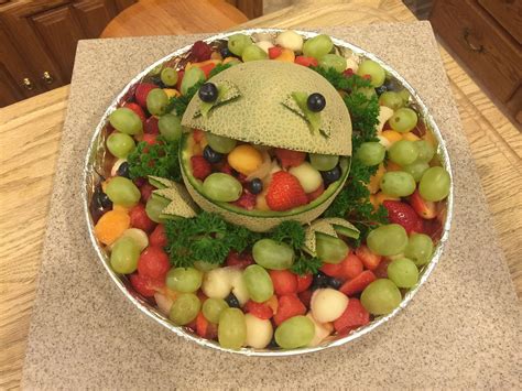 This is my fruit frog!!!! Easy to do...I'm very pleased with it!!! I added parsley around him ...