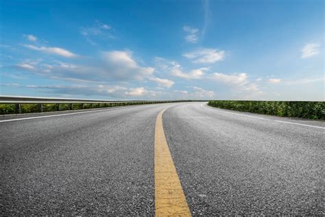 Skyline Of Asphalt Pavement And Blue Sky And White Cloud Premium Photo