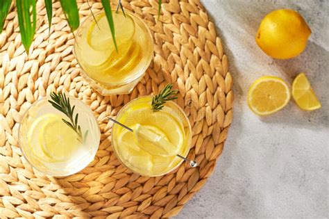 Summer Refreshing Drinks With Fresh Lemon Slices And Rosemary Sprigs