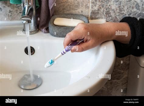 Running A Toothbrush Hi Res Stock Photography And Images Alamy