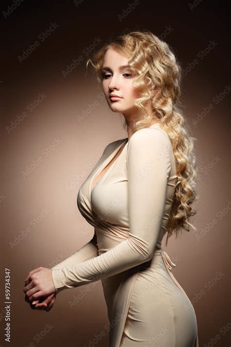 Lovely Model With Shiny Volume Curly Hair Nude Makeup Stock Photo Adobe Stock