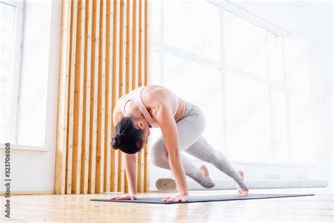 Purposeful young woman athlete doing workout getting ready for ...