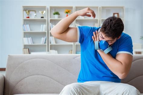 Premium Photo Man Sweating Excessively Smelling Bad At Home