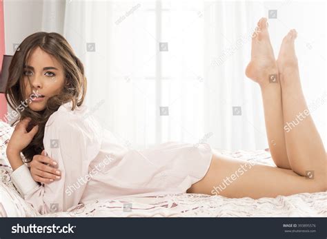 Sensual Brunette Woman Lying On Bed Stock Photo 393895576 Shutterstock