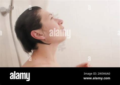 Naked Woman Takes A Shower Woman Washes Her Short Hair With Water Slow Motion Video In White