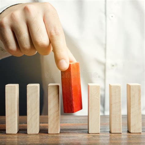 Businessman Holds A Wooden Block In His Hands The Concept Of Personnel