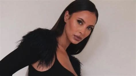 In A Figure Hugging Black Dress With A Racy Split Maya Jama Shows Off