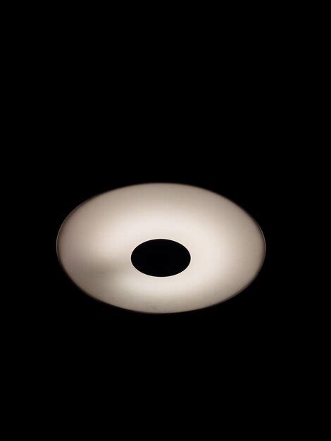 Premium Photo Close Up Of Light Bulb Over Black Background