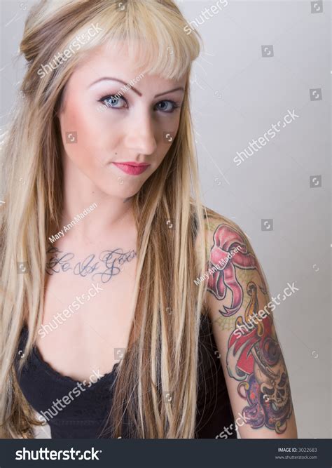 Blonde Biker Chick Covered In Tattoos And A Smug Expression Stock Photo 3022683 Shutterstock
