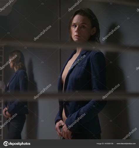 Beautiful Woman In A Jacket Worn On A Naked Body Gray Background With Red Backlight Stock