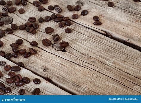 Spilled Coffee Beans On Wooden Table Closeup Stock Photo Image Of