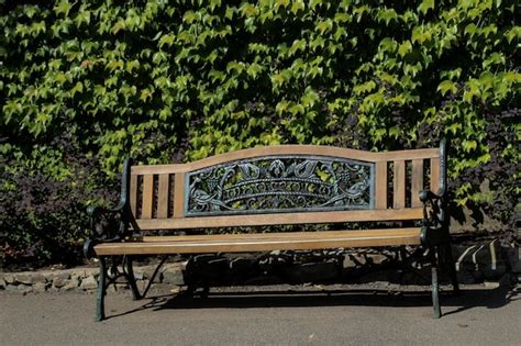 Premium Photo | Wooden park bench at a park