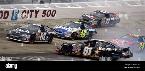 NASCAR race car driver Joe Nemechek in the #01 U.S. Army Chevrolet spins his car out of control ...