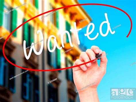 Man Hand Writing Wanted With Black Marker On Visual Screen Stock Photo