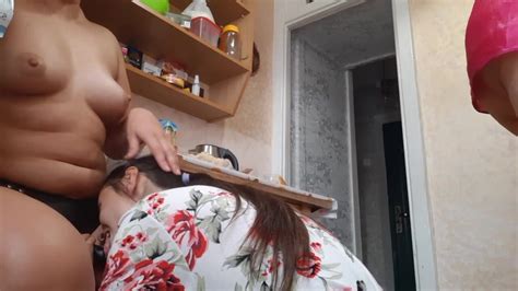 Lesbian Woman Banging With A Strap On Her Female Partner In The Kitchen