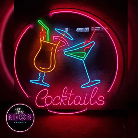 Neon Cocktails Bar Sign In Circle Frame With Lettering On Dark Brick Wall Background Glowing Gas