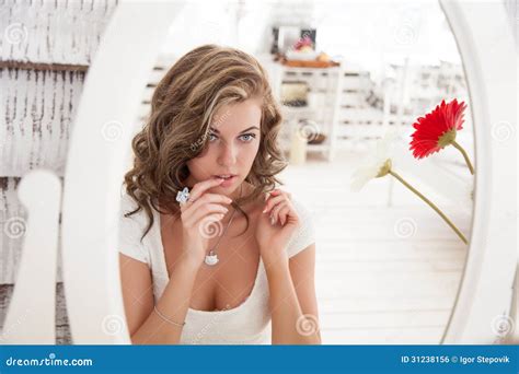 Woman Looking Into Mirror Telegraph