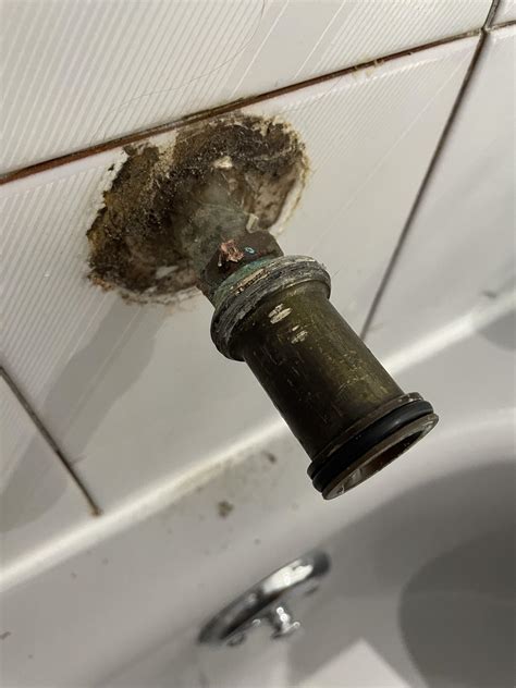 Replacing old tub faucet. What should be removed and how? At the nut, or is that part of the ...