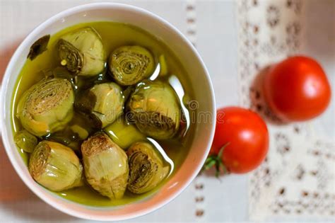 Italian Food Pickled Drilled Artichokes Hearts In Olive Oil Stock