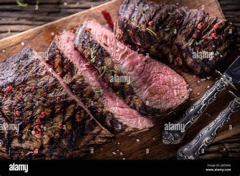 Grilled Beef Steak Cut On A Butcher Board Top Of View Stock Photo Alamy