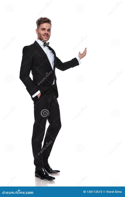 Elegant Man In Tuxedo Presenting Something Stock Image Image Of