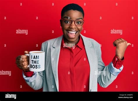 Young African American Woman Drinking From I Am The Boss Coffee Cup