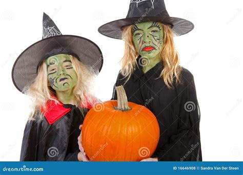 The Scary Green Face Witch With Black Outfit And Pointed Hat In Front