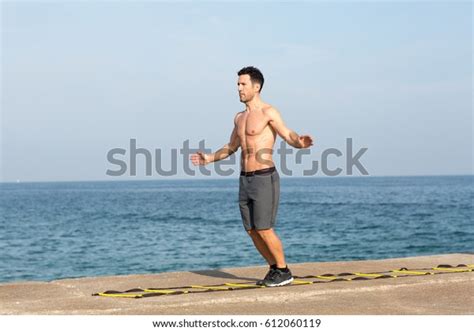 Athletic Man Naked Muscular Upper Body Making Training On Agility