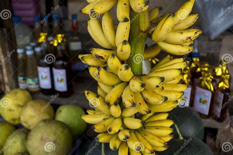 An Entire Stalk Of SeÃ±orita Bananas For Sale Together With Other