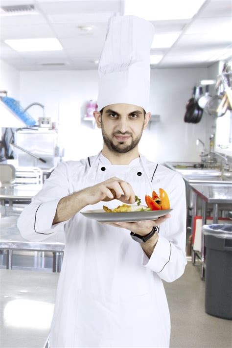 Italian Chef Preparing Dish In The Kitchen Stock Image Image Of