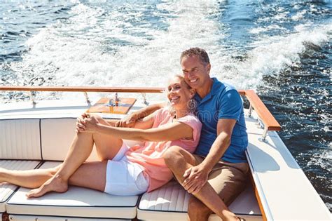 Treating Themselves To A Romantic Boat Ride A Mature Couple Enjoying A