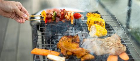 Delicious Grilled Meat With Smoke Bbq With Vegetables In Outdoor Barbecue Party Lifestyle