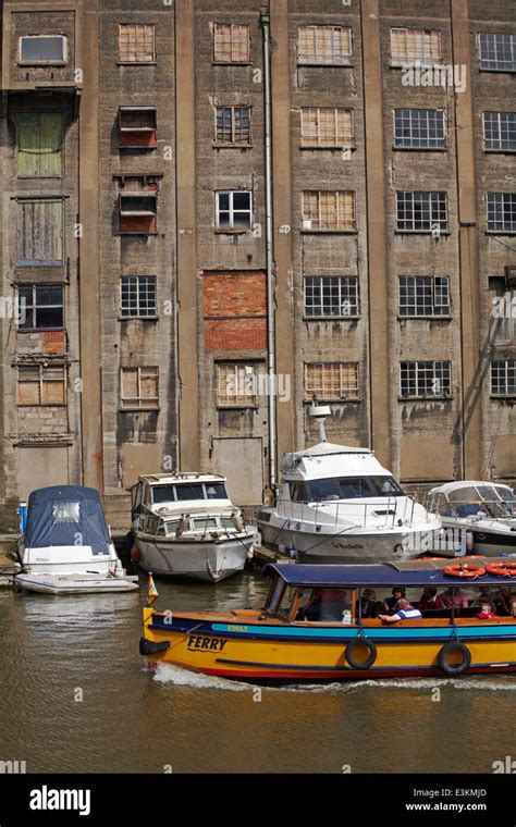 Contrast Of Ferry And Modern Boats With Ruined Derelict Building On