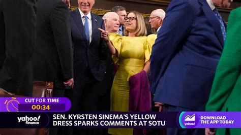 Sen. Sinema stands out at State of the Union in yellow dress