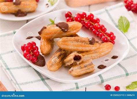 Mini Churros with Chocolate Dipping Sauce. Stock Image - Image of ...