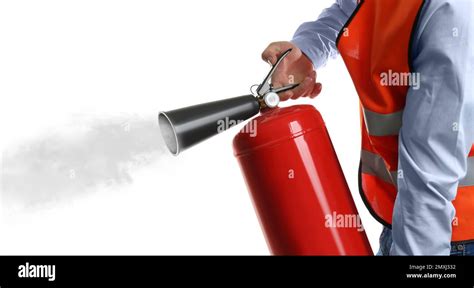 Worker Using Fire Extinguisher On White Background Closeup Stock Photo